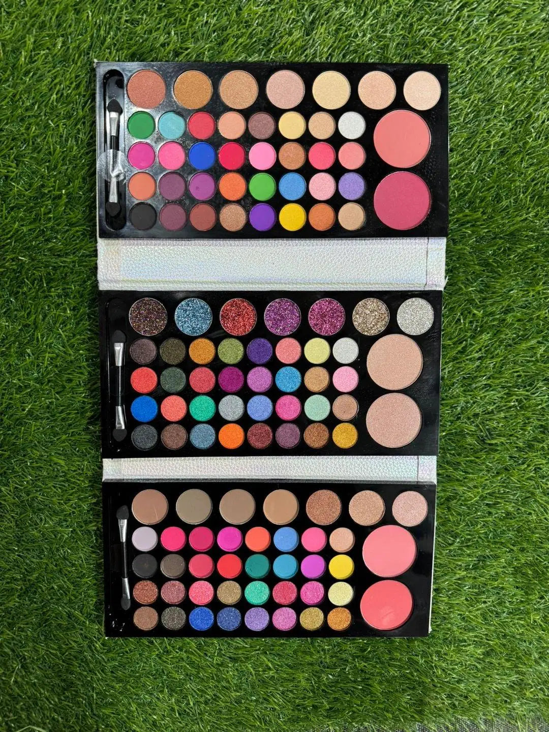 Look Loom multicolor eyeshadow palette with vibrant shades and blushes for versatile beauty looks