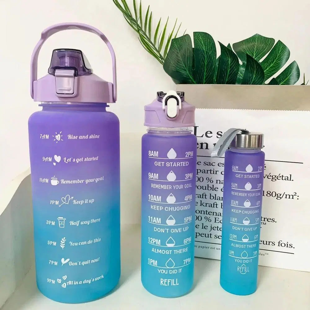 Look Loom motivational gym water bottles in gradient purple and blue with time markers and motivational quotes