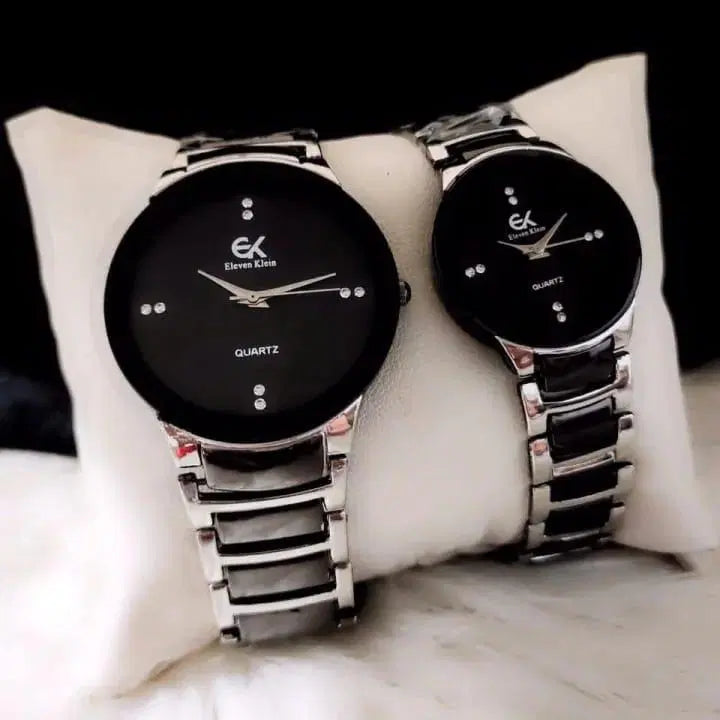 Look loom unisex couple watches set with black dials and silver metal bands on a white cushion