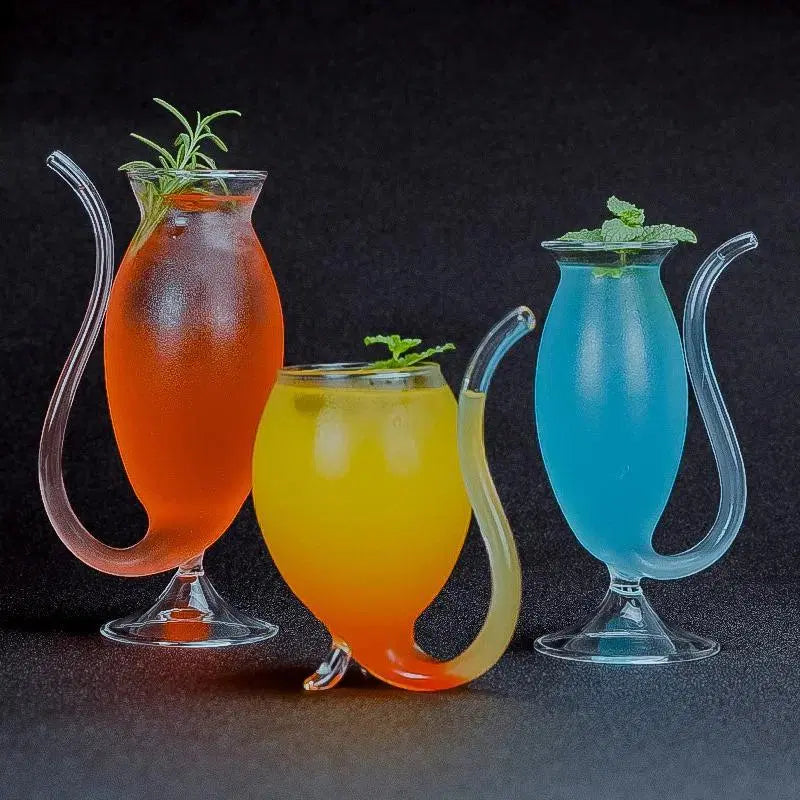 Look Loom insulated glass travel mug with curved handle in orange yellow and blue colors with herbs