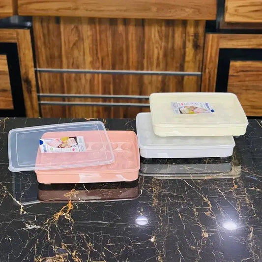 Look loom refrigerator egg organizer box sets in white and pink with clear lids on black marble countertop
