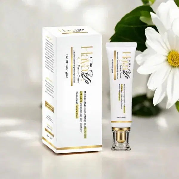 Look Loom whitening cream for face in white and gold packaging beside white flower on light background