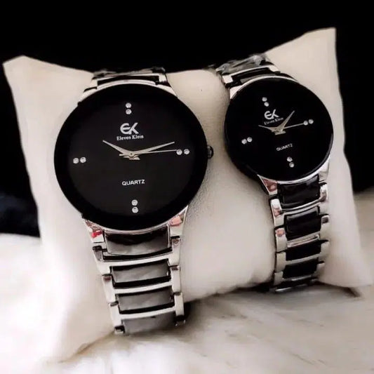 Look loom unisex couple watches set with black dials and silver metal bands on a white cushion
